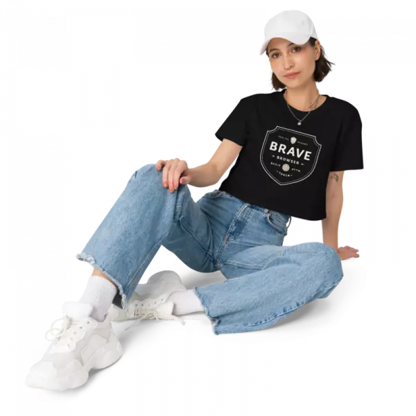 women wearing black tshirt and blue jeans