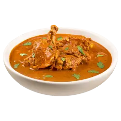 Spicy Indian chicken curry in bowl with gravy isolated on transparent background